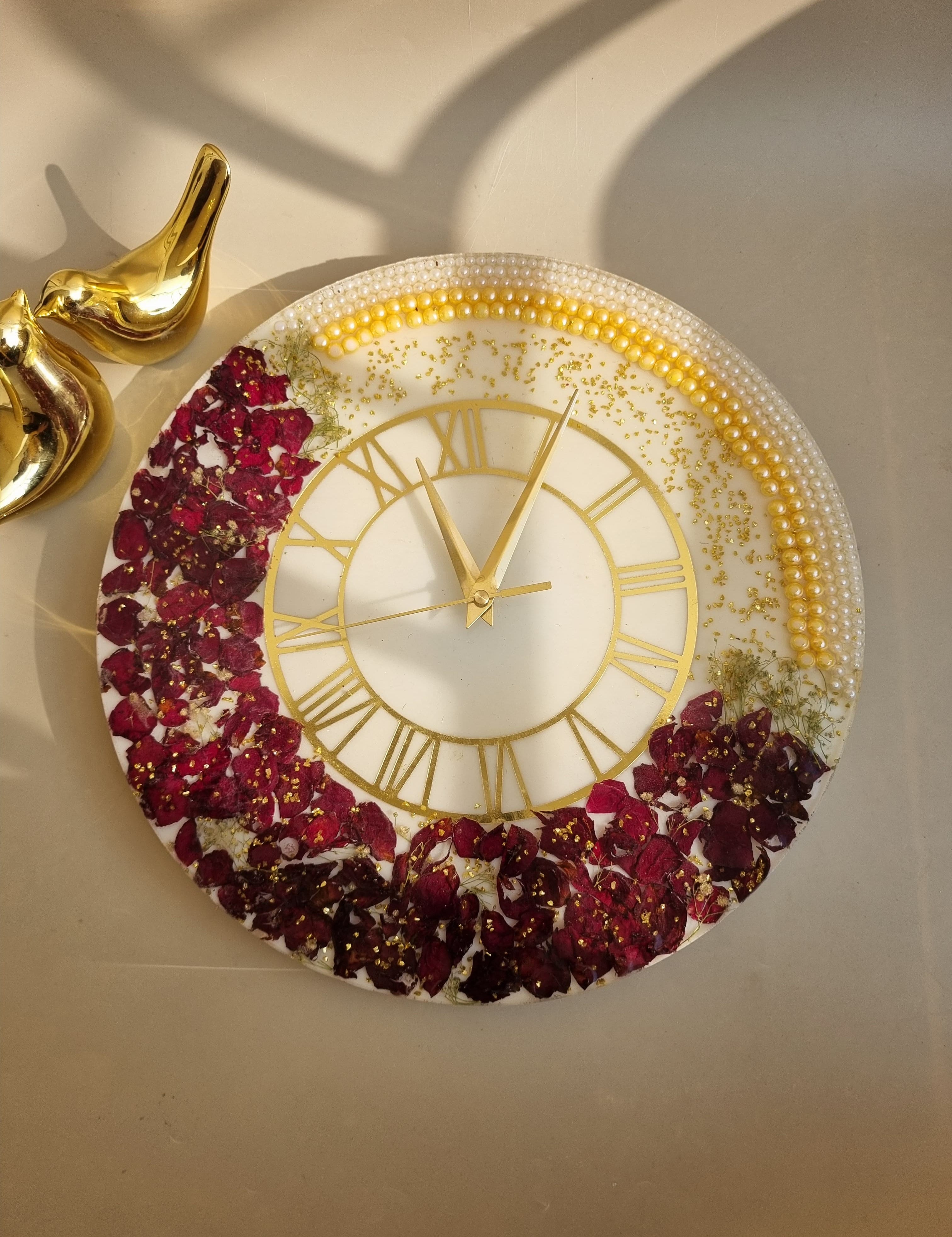 Wedding varmala preserved in resin wall clock