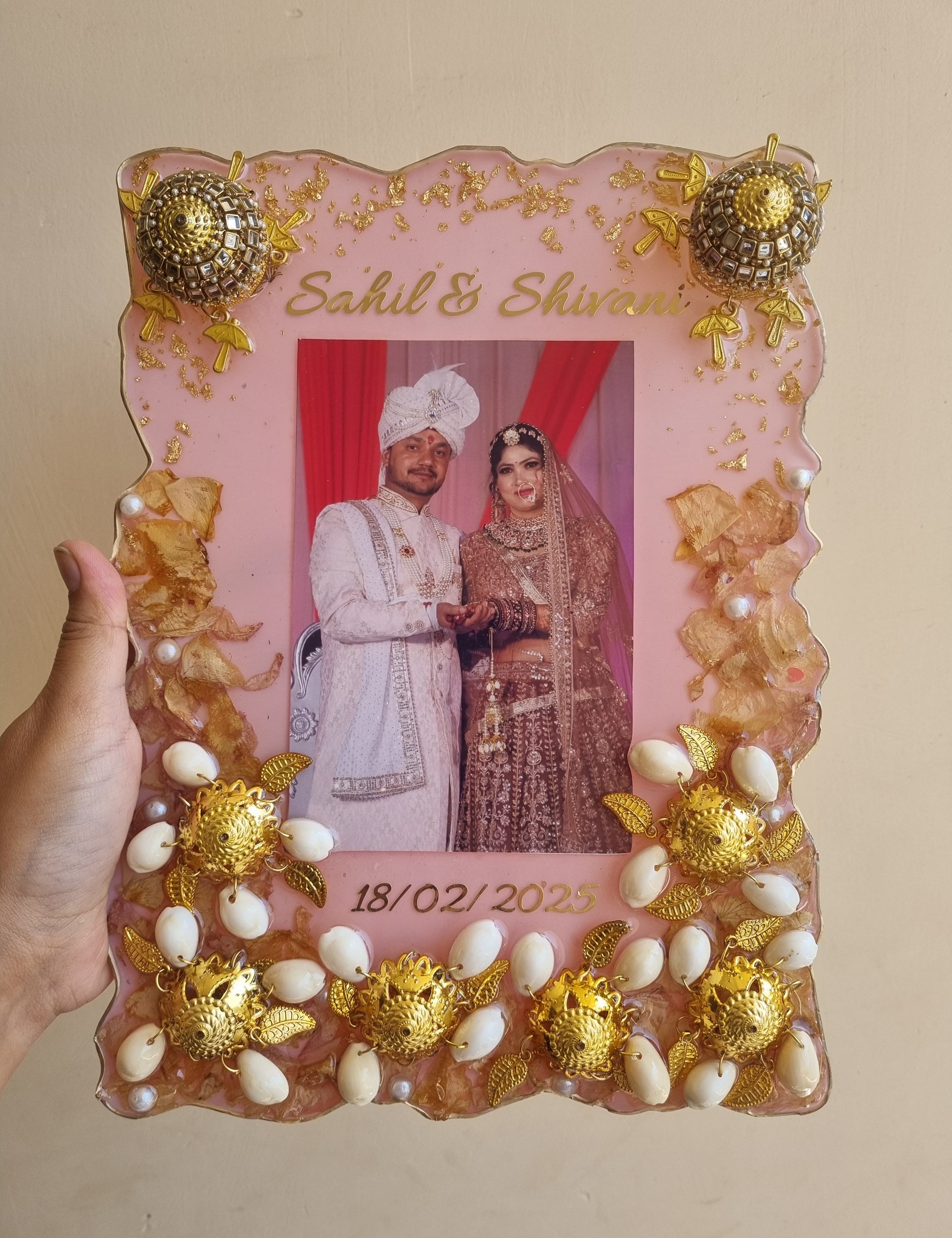 Wedding varmala preserved in resin photo frame